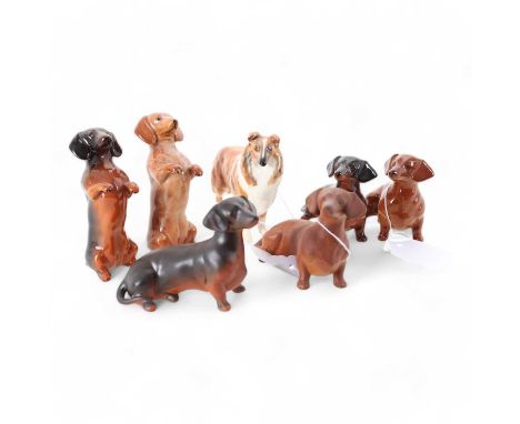 BESWICK, SEVEN DOG FIGURES, comprising numbers 1814, 1460 x 4 and two unmarkedthe largest 8.5cm highQty: 7