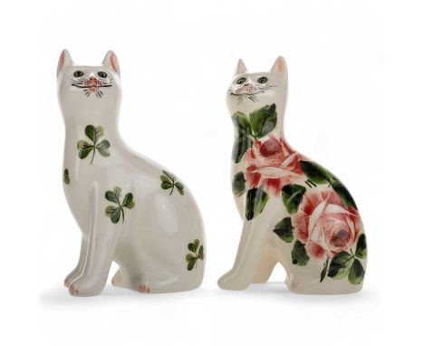GRISELDA HILL FOR WEMYSS, TWO CAT FIGURES, one decorated in the cabbage rose pattern, the other with shamrocks, each with han