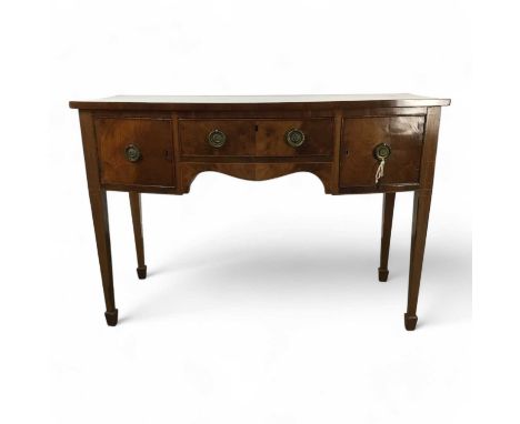 GEORGIAN BOW FRONTED SIDEBOARD, with central drawer flanked by two small cupbaords, on square tapering legs to spade feet81cm