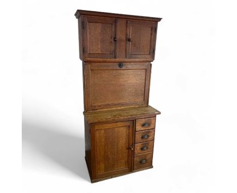 VINTAGE OAK KITCHEN UNIT, EARLY / MID 20TH CENTURY  with single top door opening to reveal a fitted interior, above four shor