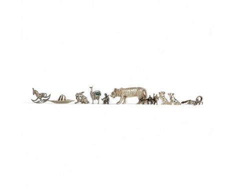 COLLECTION OF SILVER AND WHITE METAL MINIATURES, comprising a sombrero, a tiger, a seesaw, a scorpion, a rocking horse, two d