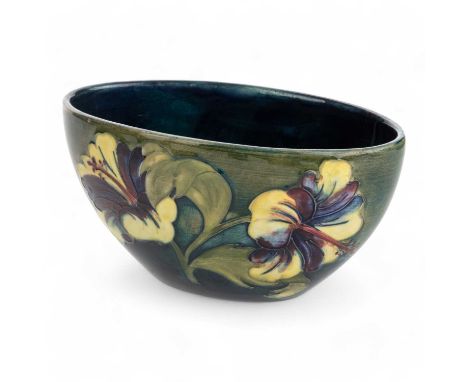 MOORCROFT BOWL, hibiscus pattern, of oval form, with tube lined floral decoration in shades of red, purple, yellow and green 