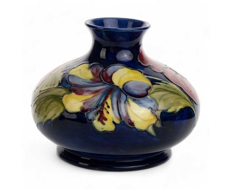 MOORCROFT VASE, hibiscus pattern, of squat circular form, with tube lined floral decoration in shades of red, purple, yellow 