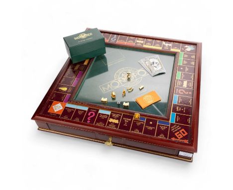 FRANKLIN MINT, COLLECTORS EDITION MONOPOLY SET, the board of rectangular form, with cards and accessoriesthe board 53cm wide