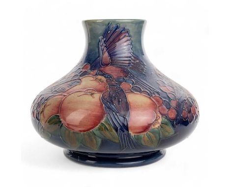 SALLY TUFFIN FOR MOORCROFT POTTERY, 'FINCHES AND FRUIT' PATTERN VASE, of squat form, marks to base20cm high In overall good c