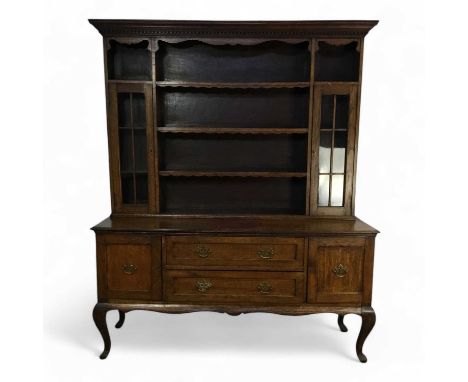 VICTORIAN OAK DRESSER, with open shelves above two long drawers, flanked by a cupboard to the left and right223cm high, 184cm