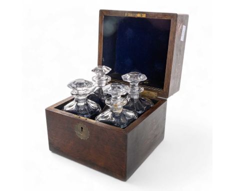 VICTORIAN ROSEWOOD DECANTER BOX, the hinged cover with flush fitting handle, with four square decanters and stoppers22cm wide