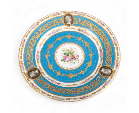 IN THE MANNER OF SEVRES, CABINET PLATE, LATE 19TH CENTURY of circular form, decorated with a central reserve of flowers withi