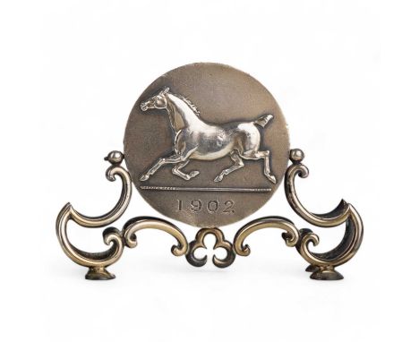 EQUESTRIAN INTEREST, DESK STAND, MAPPIN & WEBB  the circular disc decorated in relief with a horse and verso a horse and ride