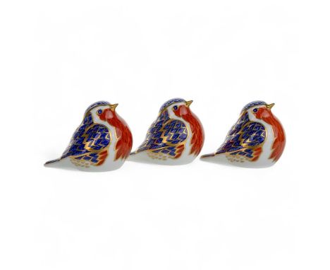 THREE ROYAL CROWN DERBY PAPERWEIGHTS, each modelled as a robin, with gilt highlights, one with a gold coloured stopper, the o