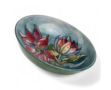 MOORCROFT BOWL, clematis pattern, of circular form, with tube lined floral decoration in shades of red, purple, yellow and gr