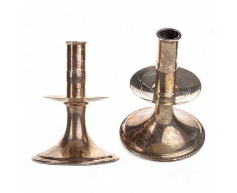 PAIR OF ARTS & CRAFTS SILVER TABLE CANDLESTICKS, RETAILED BY CARTIER of circular form with mid stage drip trays and spreading