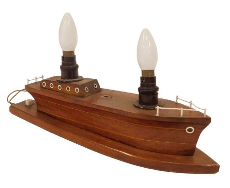 A 20thC table lamp modelled as a wooden boat, 44cm wide.Buyer Note: WARNING! This lot contains untested or unsafe electrical 