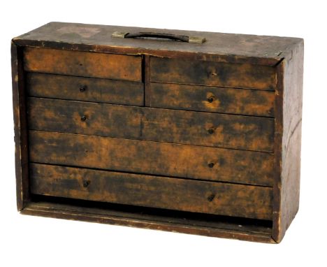 A wooden carpenter's tool chest and contents, including drill bits, chisels, lathe parts, etc., 43cm high, 61cm wide, 22cm de