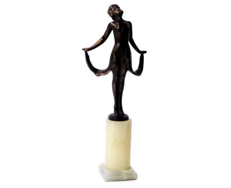 An Art Deco style bronze figure, modelled as a lady wearing dress, on onyx stand, unsigned, 21.5cm high. 