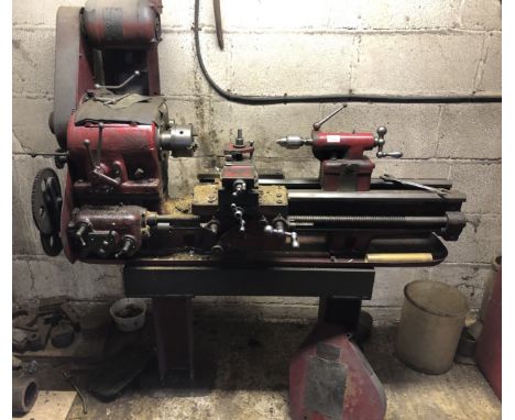 A Bentley Engineering vintage screw cutting lathe, together with extra four jaw chuck, cutting tools, change gear, etc.., 80c