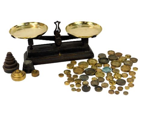 A set of Victorian cast iron and brass kitchen scales, 24cm high, together with various brass and cast iron weights.