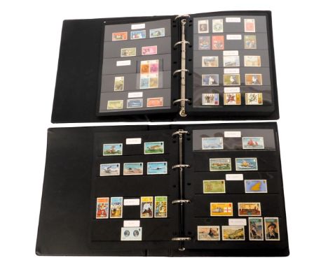 Two George V and later stamp albums, to include four George V British Empire Exhibition 1925 stamps, 1948 Olympic stamps, Eli