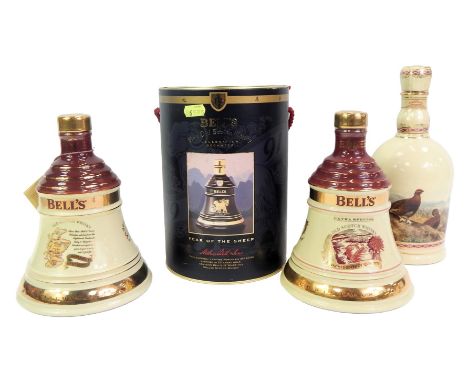 Three Bell's Scotch whisky decanters, comprising Christmas 1996, 1997, Year of the Sheep, boxed, and a Famous Grouse Highland