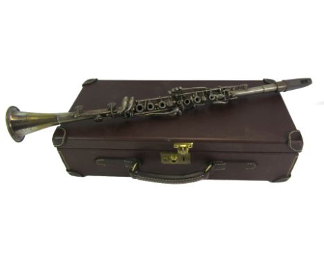 An Elkhart USA Cavalier clarinet, 69cm long, together with a Guardian brown leather case, the hinged lid enclosing four reces