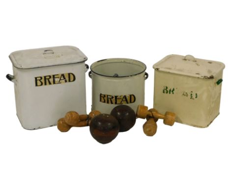 An enamel bread bin, in white, with lid, 31cm high, another, 26cm high, and a further example lacking lid. 