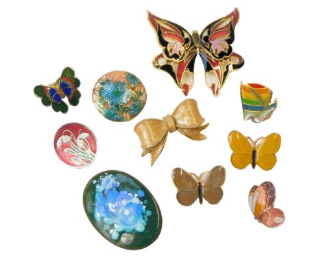 A group of enamel brooches, including butterflies, rainbow, yacht, and a tied bow. (a quantity) 
