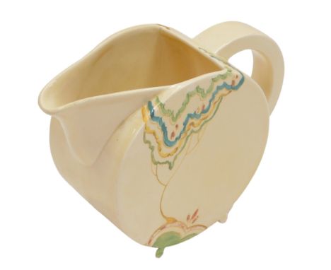 A Bizarre by Clarice Cliff milk jug, on a cream ground decorated with tree, and a Tit-Bits toby jug. (2)