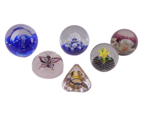 Six glass paperweights, to include Caithness Moonscape, 8cm high, Pebble, number 8997, etc.