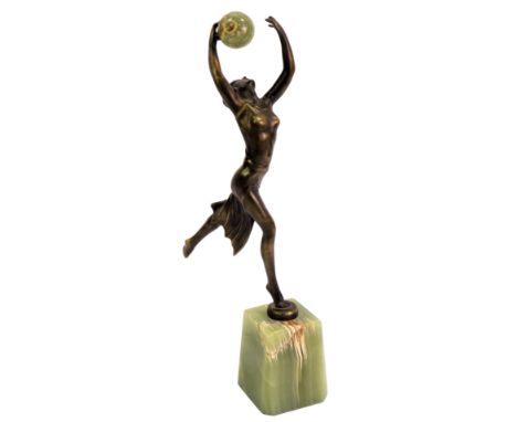 An Art Deco style figural statue, modelled as a female in flowing dress with arms raised holding an onyx ball, on a square ta