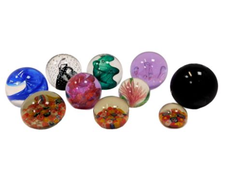A group of glass paperweights, to include Caithness Carnival, 6.5cm high, Caithness Brimston, etc. (10)