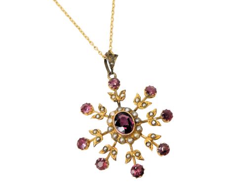 An Edwardian amethyst and seed pearl pendant, on a fine link neck chain.