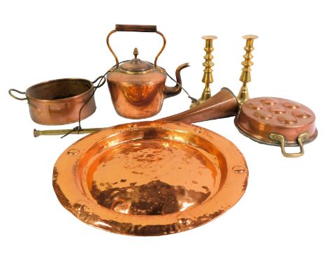 A group of copper and brassware, to include a hammered brass charger with roundel decoration to border, 40cm diameter, a Vict