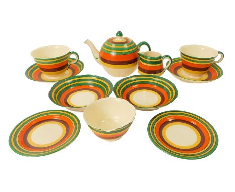 A Bishop pottery part tea service, Bisto Rainbow ware, comprising bachelor's teapot, three teacups, four saucers, of differin