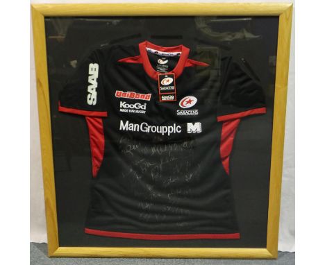 Framed Saracens rugby black with red trim KooGa shirt (Man Group plc), signed, 88.5 x 96 cm. P&amp;P Group 1 (£14+VAT for the