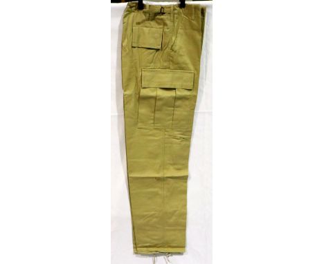 Ten pairs of new combat trousers, sizes 32 inch - 38 inch. P&amp;P Group 3 (£25+VAT for the first lot and £5+VAT for subseque
