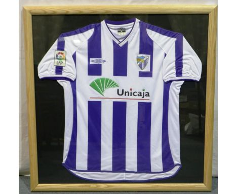 Framed Malaga FC blue and white stripe Umbro shirt (Unicaja), 96 x 96 cm. P&amp;P Group 1 (£14+VAT for the first lot and £1+V