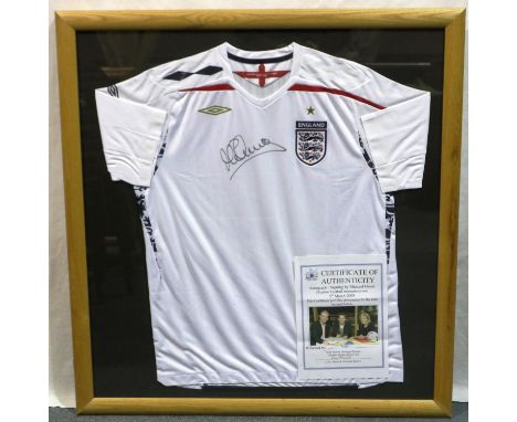 Framed England FC white Umbro shirt signed by Michael Owen and photo certificate of authenticity signed 05/03/08, 88 x 93.5 c