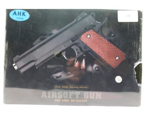 New boxed 6mm airsoft BB pistol, model V13, in tan. P&amp;P Group 2 (£18+VAT for the first lot and £3+VAT for subsequent lots