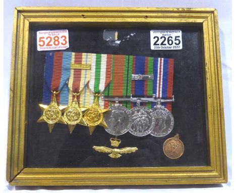 RAF court mounted group of British WWII medals, including Africa Star and a Canadian medal, framed, re-struck examples. P&amp