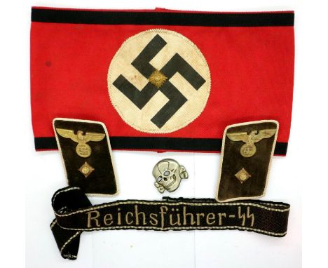 A Third Reich period German political armband of multi-piece construction with a Reichsfuhrer SS cuff title, deaths head cap 