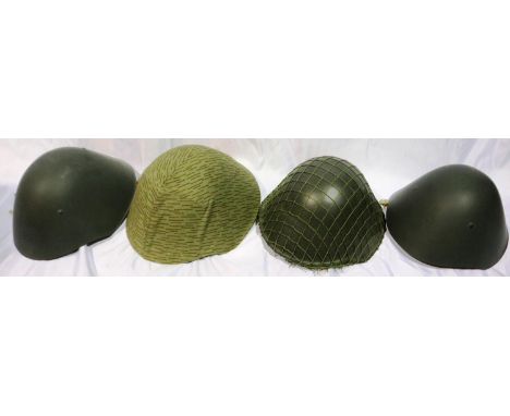Four East German DDR issue helmets. P&amp;P Group 3 (£25+VAT for the first lot and £5+VAT for subsequent lots) 