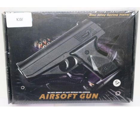New boxed 6mm airsoft pistol, model V7, in tan. P&amp;P Group 2 (£18+VAT for the first lot and £3+VAT for subsequent lots) 
