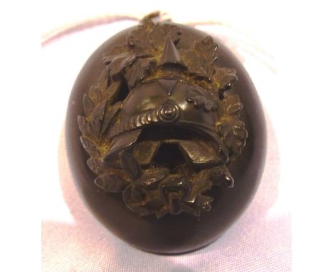 Rare black forest carved sweetheart locket, bearing a Pickelhaube amongst oakleaves to the cover, likely 19th century, hinge 