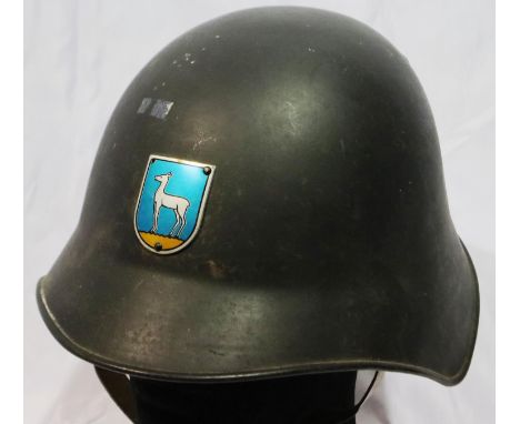 Swiss steel helmet with division plate, having leather liner and chinstrap. P&amp;P Group 2 (£18+VAT for the first lot and £3
