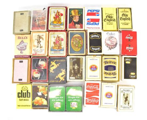 Twenty-eight packs of playing cards, each with branding for drinks companies, to include rare examples (28).