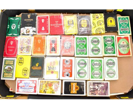 Sixty packs of playing cards, all with beer and alcohol branding, to include Guinness, Boddington, Heineken, Budweiser, etc (