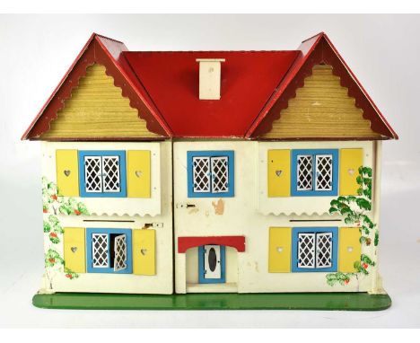 A mid-20th century dolls house, cream with red roof, blue window frames with lattice panels and yellow shutters, height 47cm,