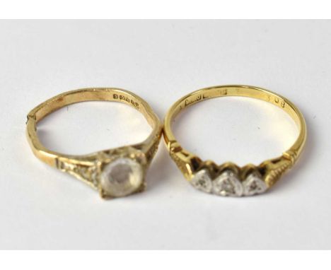 A 9ct gold ring set with central white stone, size K, approx. 2.22g (af) and a yellow metal ring set with chip diamonds in a 