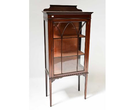 An Edwardian mahogany line inlaid display cabinet, with single glazed door enclosing two shelves, raised on square tapering s