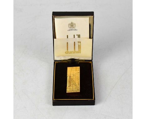 DUNHILL; a boxed textured gold-plated lighter, with paperwork, 6.5 x 2.5cm.Condition Report: Currently has no fluid or flint 